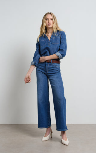 Women wearing a high waisted wide leg cropped jeans in Pacific blue denim