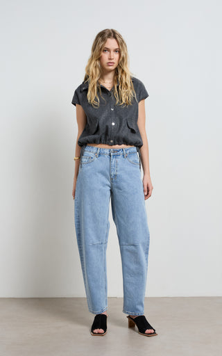 Mid rise barrel jeans offering stylish comfort and versatile fashion for modern wardrobes.