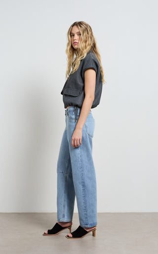 Mid rise barrel jeans offering stylish comfort and versatile fashion for modern wardrobes.