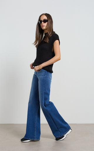 Women wearing a high waisted flare leg jeans in Pacific blue denim