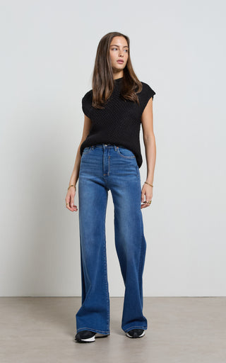 Women wearing a high waisted flare leg jeans in Pacific blue denim