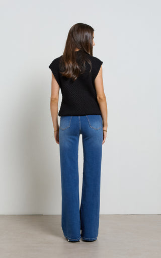 Women wearing a high waisted flare leg jeans in Pacific blue denim