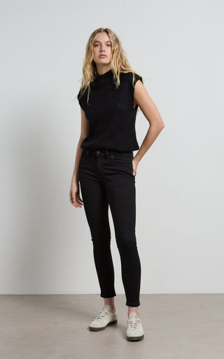 Lauren wearing stylish black skinny jeans, showcasing a sleek and modern fashion look.