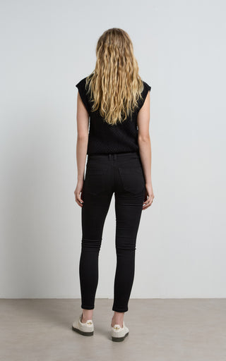 Lauren wearing stylish black skinny jeans, showcasing a sleek and modern fashion look.
