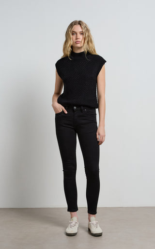 Lauren wearing stylish black skinny jeans, showcasing a sleek and modern fashion look.