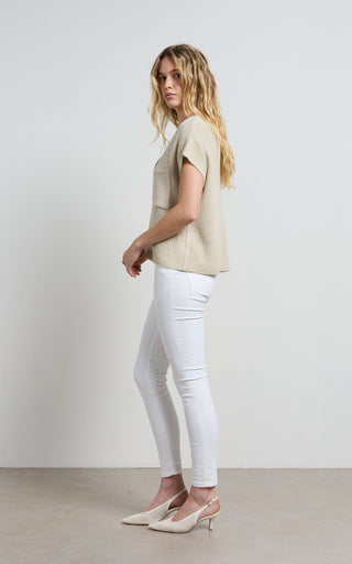 Mid rise white jeans perfectly tailored for a stylish and comfortable fit, ideal for versatile wardrobe options.