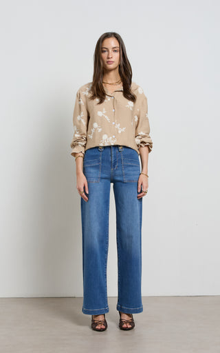 Women wearing straight leg wide jeans in indigo blue denim