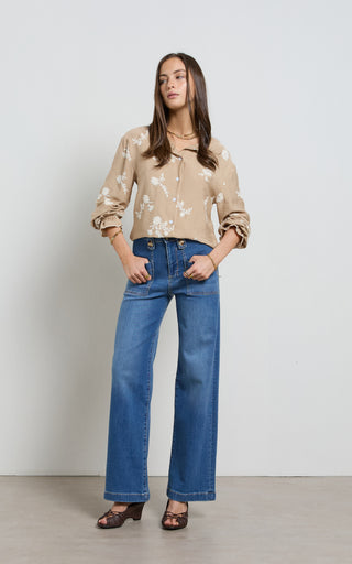 Women wearing straight leg wide jeans in indigo blue denim