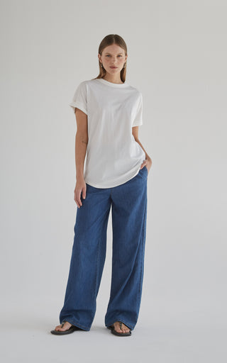 Camila wearing stylish wide leg denim pants showcasing classic denim fashion for a modern look