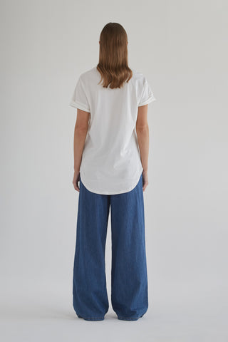Camila wearing stylish wide leg denim pants showcasing classic denim fashion for a modern look