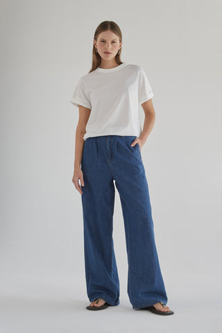 Camila wearing stylish wide leg denim pants showcasing classic denim fashion for a modern look